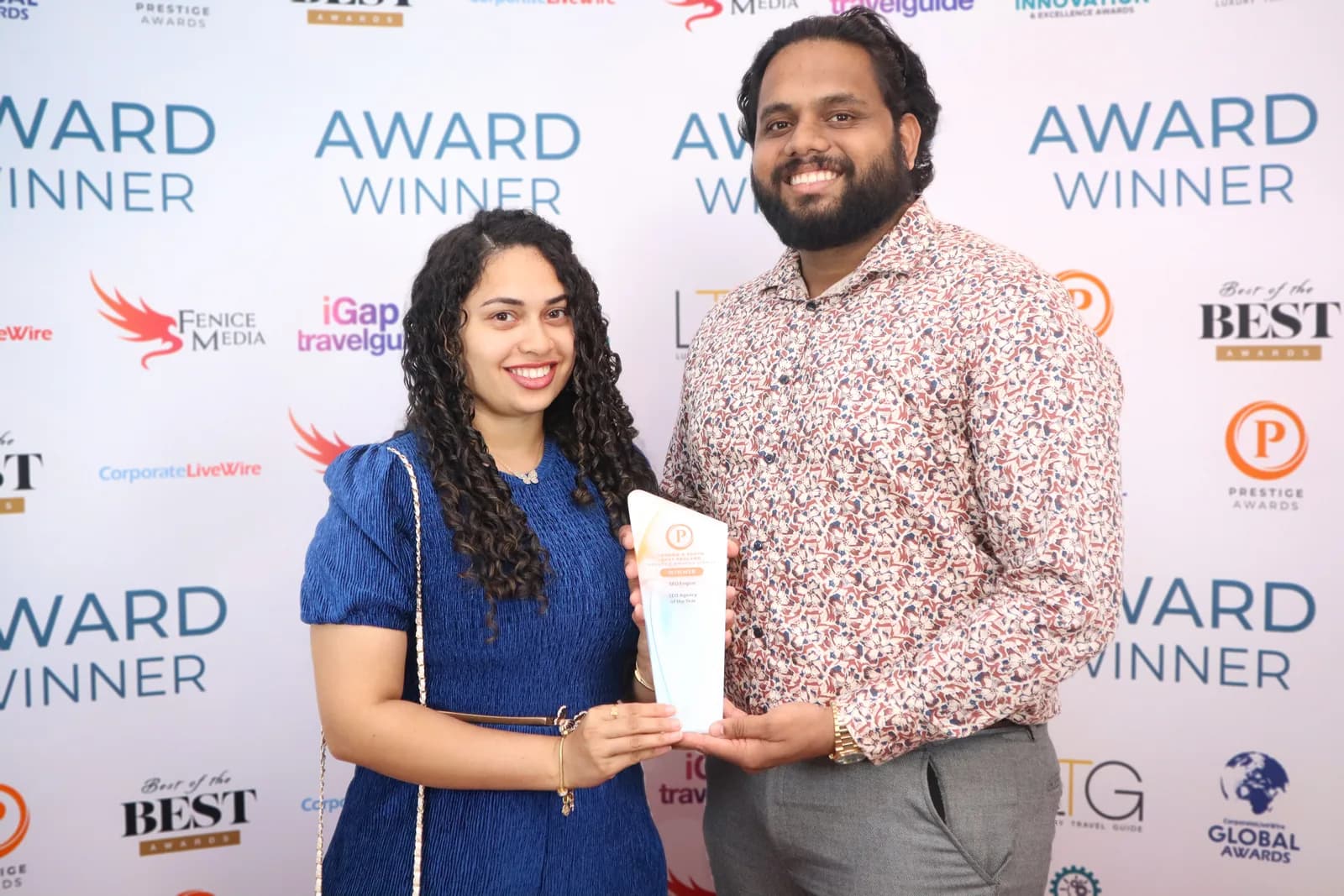 Jhonty Barreto and Vellinka Rebelo of SEO Engico holding the Prestige Awards SEO Agency of the Year trophy